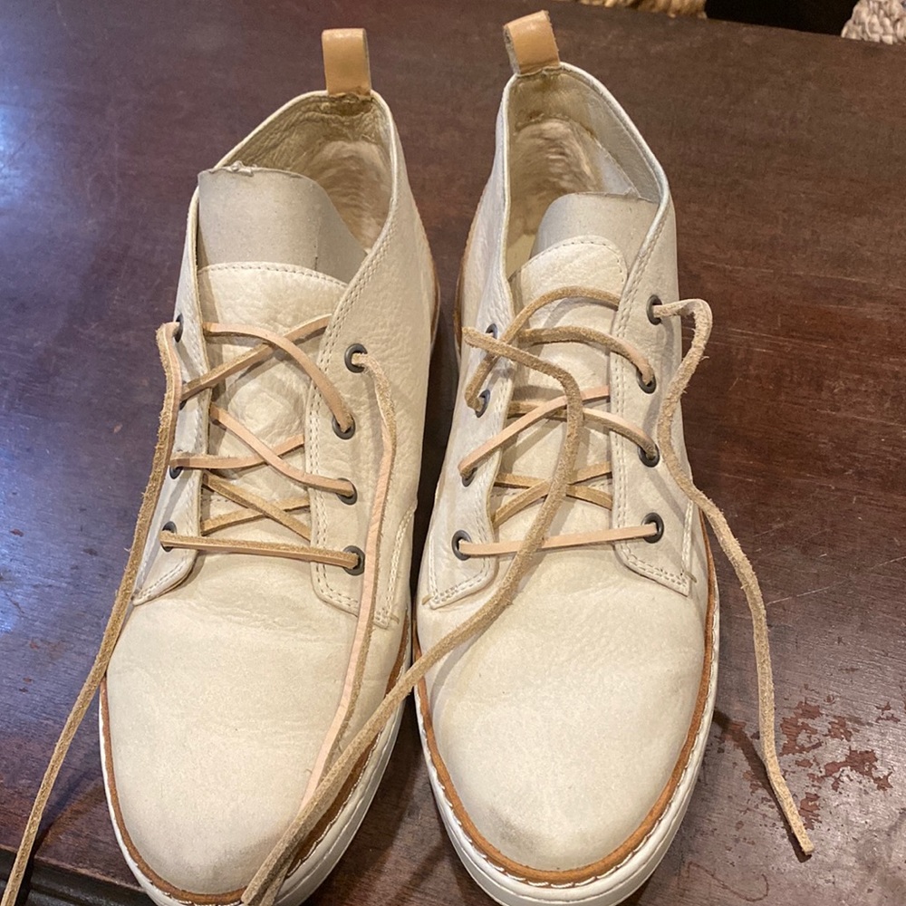 UGG lace up sneaker, worn once. Leather with leather patch and stitching